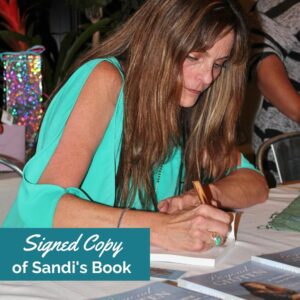 Photo of Sandi Star signing her book